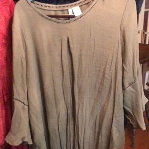 Rayon poly mix.  So wrinkly top